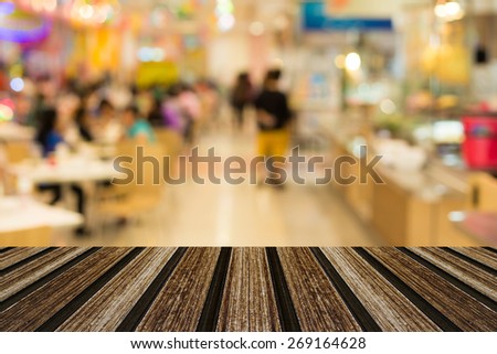 Selected focus Empty table and blurred store with bokeh background, product display template  for your photomontage or product display.