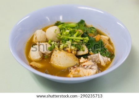 Fish soup with vegetables and pasta.