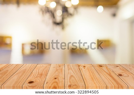 Selected focus empty brown wooden table and Coffee shop blur background with bokeh image, for product display montage.