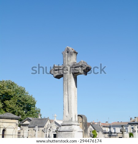 Grave cross in cemetery