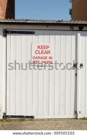 Keep Clear Garage in Use 24 Hours sign - on garage door