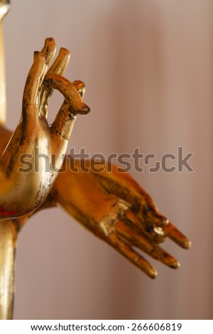 Finger golden Buddha statue