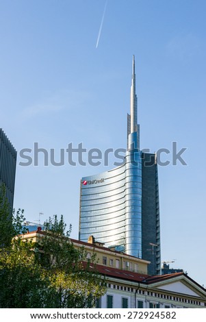 Milan, Italy - April 25, 2015: Unicredit Tower building in Milan, modern skyscraper in glass behind traditional building