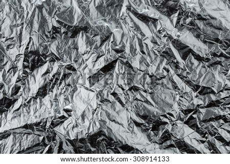 crumpled turquoise foil wrapping paper