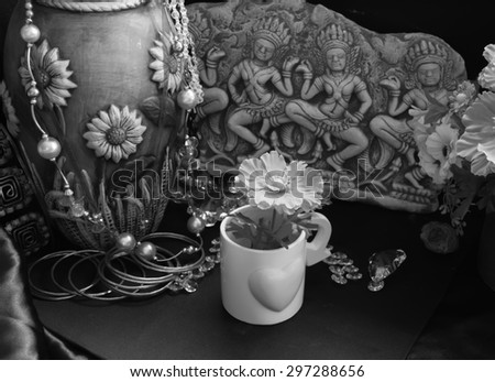 still life of the contrast black and white with cultural and modern objects