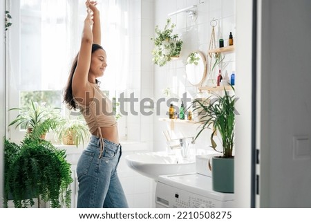 Similar – Image, Stock Photo Anonymous woman stretching body in seated forward bend position