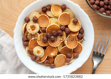 Similar – Image, Stock Photo Tiny cereal pancakes and strawberries