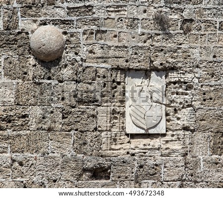 https://image.shutterstock.com/display_pic_with_logo/2449808/493672348/stock-photo-wall-of-fortress-of-rhodes-castle-close-up-with-traces-from-bullets-and-shattered-arms-493672348.jpg