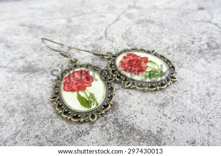 Beautiful earrings with flowers in epoxy resin. Women\'s handmade jewelry, accessory.