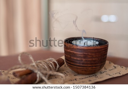 candle with a smoke cinnamon sticks decor home Stock fotó © 