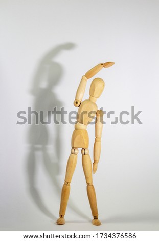 Similar – Image, Stock Photo wooden doll during yoga practice Ansanas, triangle Trikonasana, in front of white background