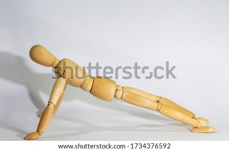 Similar – Image, Stock Photo wooden doll during yoga practice Ansanas, triangle Trikonasana, in front of white background