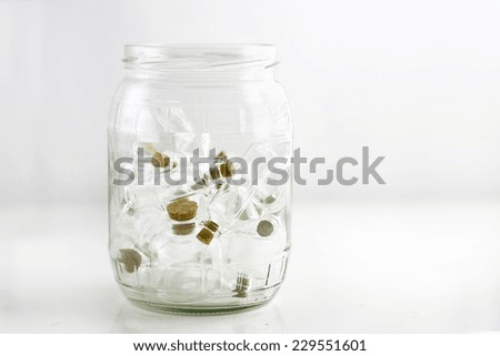 tiny glass jars in large glass jar