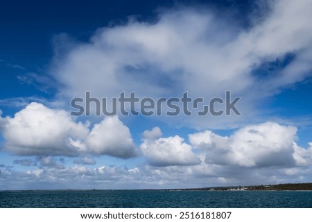 Similar – Image, Stock Photo Fair weather clouds in front of a blue sky and a small section of a red tiled roof with a parabolic antenna / satellite dish / football transmission