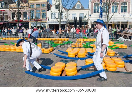 ALKMAAR, NETHERLANDS - APRIL 8: Cheese carriers at the traditional cheese market, Alkmaar, Netherlands on April 8, 2011. The market is open on Friday mornings from April to September in the city center.