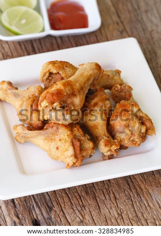 The most amazing Salt and Pepper Chicken Wings deep fried on wood background