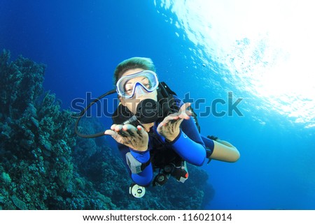 Female Scuba Diver having fun underwater