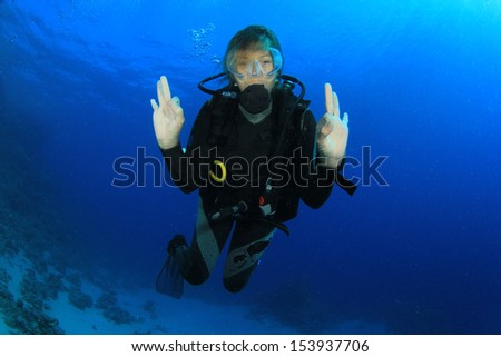Female Scuba Diver underwater having fun