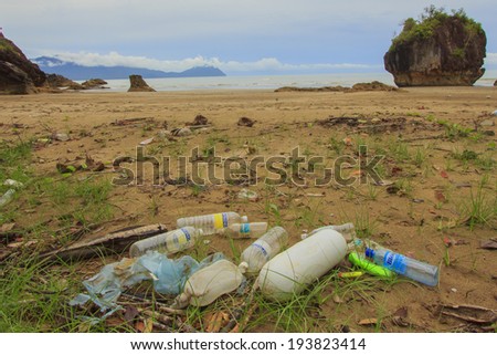 BAKO NATIONAL PARK, MALAYSIA - MAY 09 2014: Plastic pollution on remote tropical beach. Photo shows problem of plastic pollution in oceans, with non-biodegradable plastics drifting onto nature areas.