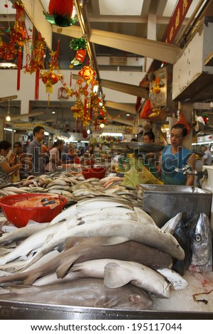 TEKKA SEAFOOD MARKET, SINGAPORE - MAY 27 2014: Sharks at fish market. Dead sharks are sold at market for their fins, used in shark fin soup, a traditional Chinese dish.