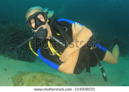Blonde female scuba diver