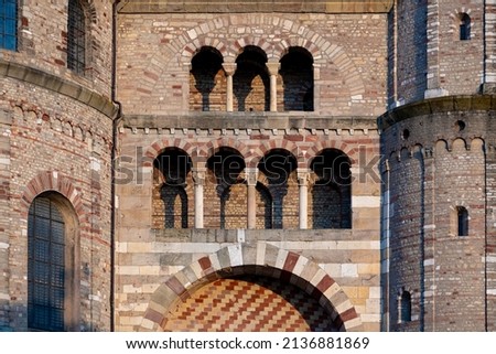 The High Cathedral of Saint Peter or Trier Cathedral, is a Roman Catholic cathedral in Trier, Rhineland-Palatinate, Germany. Facade with brick and quarry stones, arches, windows and columns. Foto d'archivio © 