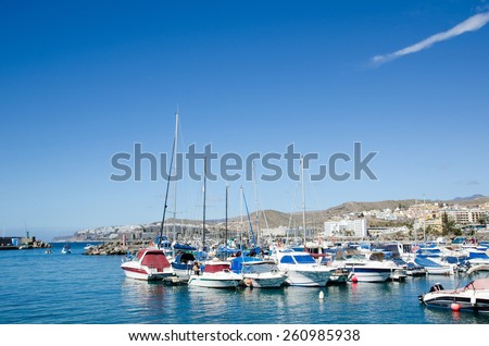 ARGUINEGUIN, SPAIN - FEBRUARY 17; View over the popular harbor at the resort Arguineguin at the island Gran Canaria, Canary Islands in Spain.  Photo taken on February 17, 2015, in Arguineguin, Spain.