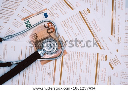 Medical stethoscope, fifty euros banknote, and the french document Avis d'arret de travail. Sick leave issued by the treating doctor. Medical justification. Metaphor for expensive medical consultation Imagine de stoc © 