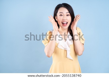 Similar – Image, Stock Photo young woman wearing yellow raincoat standing next to hammock with her jack russell dog. autumn season. camping concept