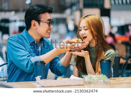 Similar – Foto Bild Fröhliches Paar beim Mittagessen im Cafe