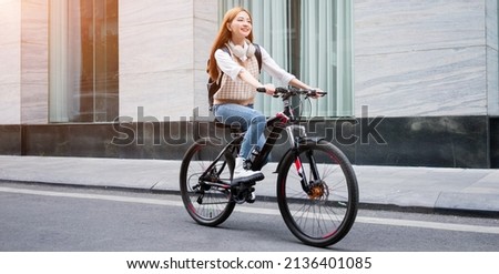 Similar – Image, Stock Photo Young woman going for a bicycle ride in the park