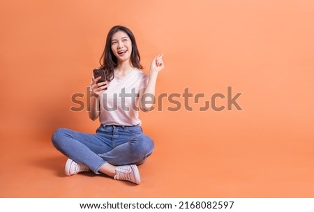 Similar – Image, Stock Photo Young female sitting on pier on nature