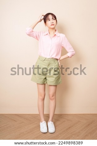 Similar – Image, Stock Photo Thoughtful young woman standing near modern building