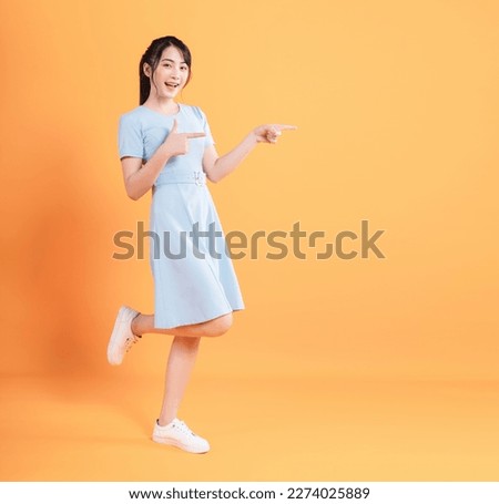 Similar – Image, Stock Photo Young woman in dress sitting in dark room