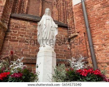 Statue of Mary against a brick wall in a Gothic Cathedral Imagine de stoc © 