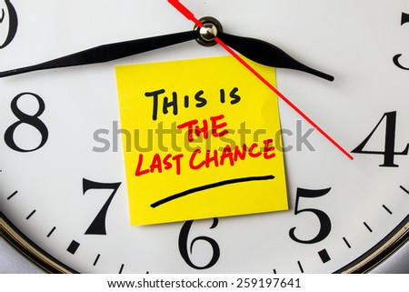 time for last chance on post-it stuck to a wall clock