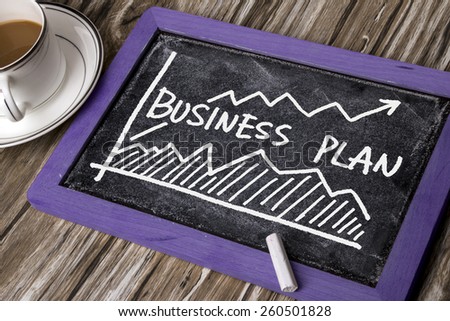 business plan with financial chart hand-drawn on blackboard