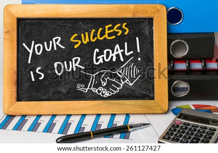 your success is our goal handwritten on blackboard