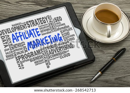 affiliate marketing concept handwritten on tablet pc with related words cloud