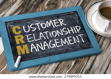 customer relationship management concept handwritten on blackboard