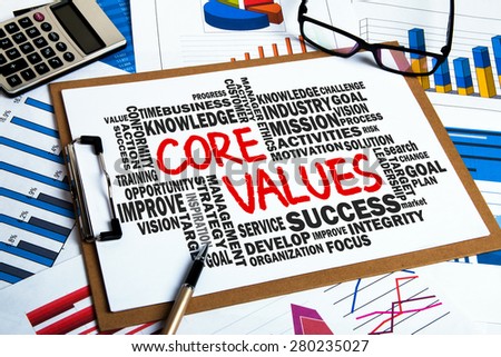 core values concept with business word cloud handwritten on clipboard