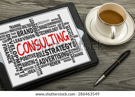 consulting word cloud concept hand drawn on tablet pc