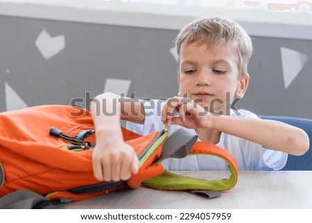 Similar – Image, Stock Photo A boy is putting on a diving mask ready to swim in the sea. White yacht is on the background