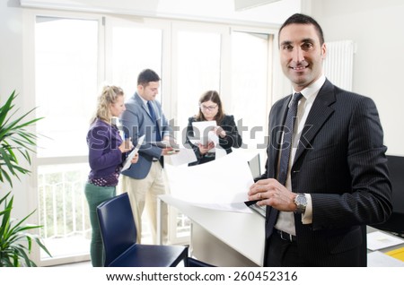 Businessman  with people in  background