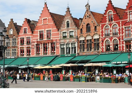 The Market Place in spring/ Bruges / Bruges, Belgium - CIRCA May, 2011; The Market Place with its cafe and restaurants on a spring day. The Market Place is the medieval commercial center of the city.
