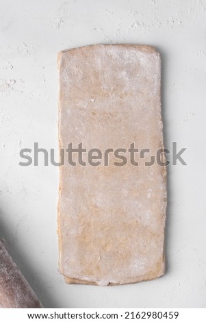 Similar – Image, Stock Photo Dough rolled out on a green background. Homemade pie crust and rolling pin. Baking concept