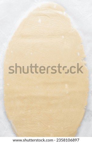 Similar – Image, Stock Photo Dough rolled out on a green background. Homemade pie crust and rolling pin. Baking concept