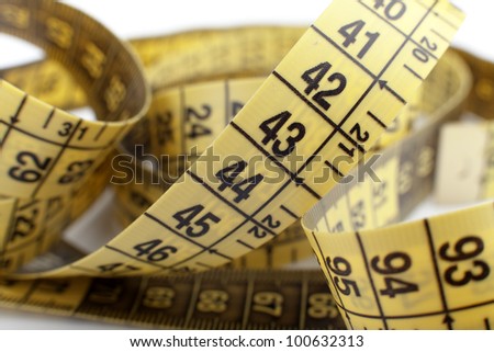 yellow tape measure on the white background