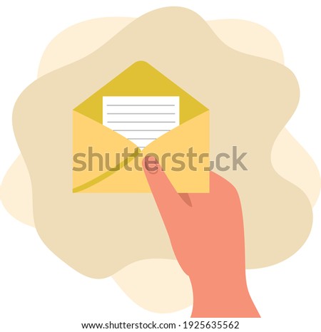A woman's hand holds an open envelope with a letter