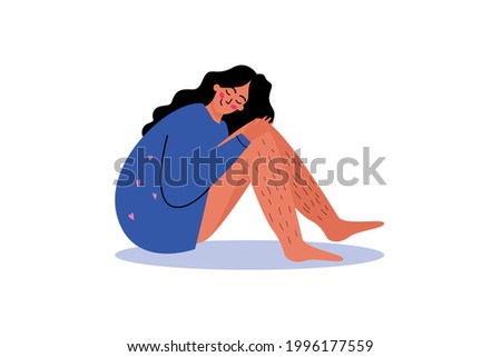 A cute young woman is sitting hugging her knees. A woman with hairy legs. The concept of love and self-care Photo stock © 